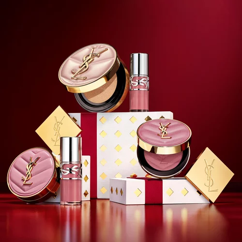 Prodotti make-up YSL con confezioni regalo festive.