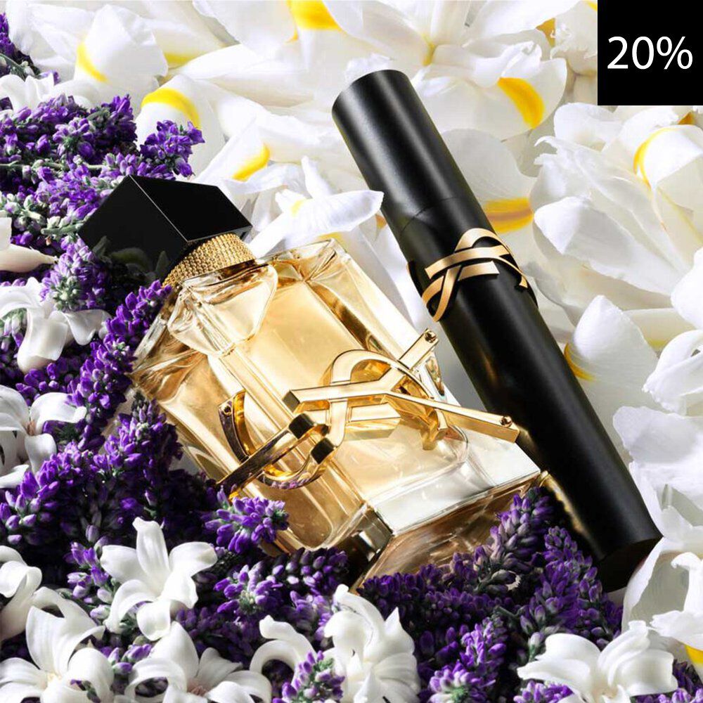 Un primo piano di un'elegante boccetta di profumo YSL Libre e di un mascara YSL nero, entrambi con dettagli dorati, adagiati tra vivace lavanda viola e delicati fiori bianchi e gialli. Un quadrato nero con il testo bianco '20%' e visibile nell'angolo in alto a destra, a indicare uno sconto.