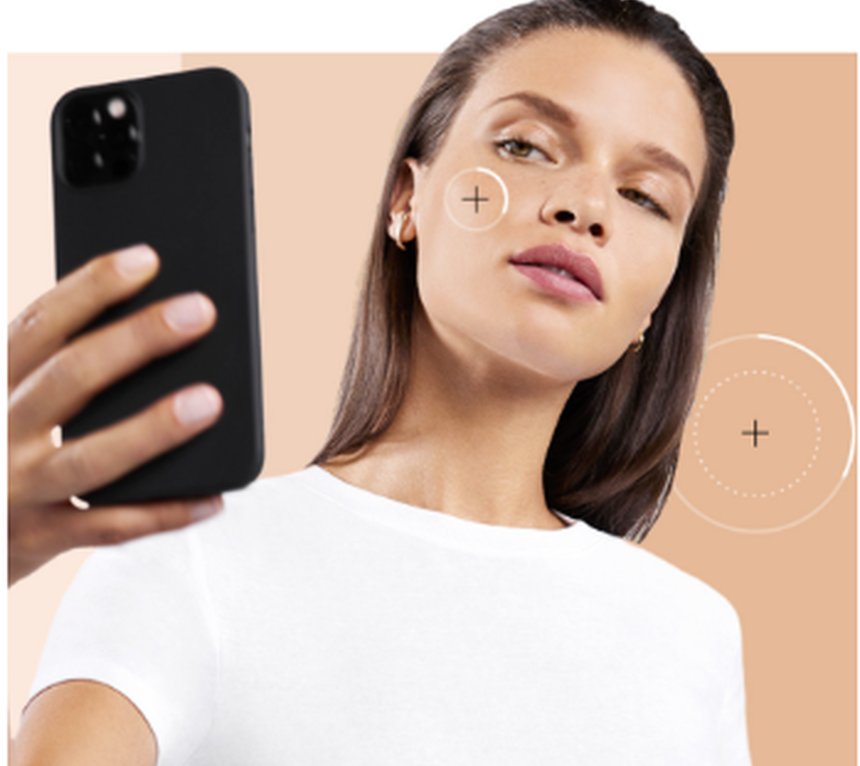 A woman with long brown hair takes a selfie with a smartphone, showcasing a neutral expression. The background features a gradient of skin tone colors.