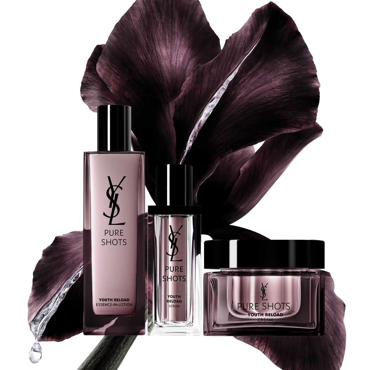 Prodotti skincare YSL Pure Shots davanti a uno sfondo floreale scuro.