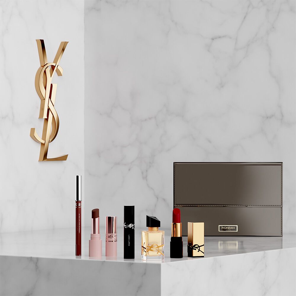 Set beauty YSL con mini prodotti e pochette.