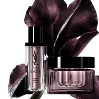Two purple skincare products with dark flower petals