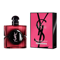 Flacone di Black Opium Eau de Parfum Pink Glaze accanto alla
                        sua confezione fucsia e nera con il Cassandre YSL.
