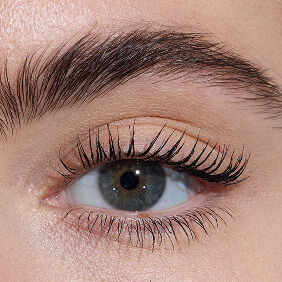 Close-up of an eye with light skin tone, showcasing lengthened lashes from YSL Lash Latex Mascara with level three intensity.